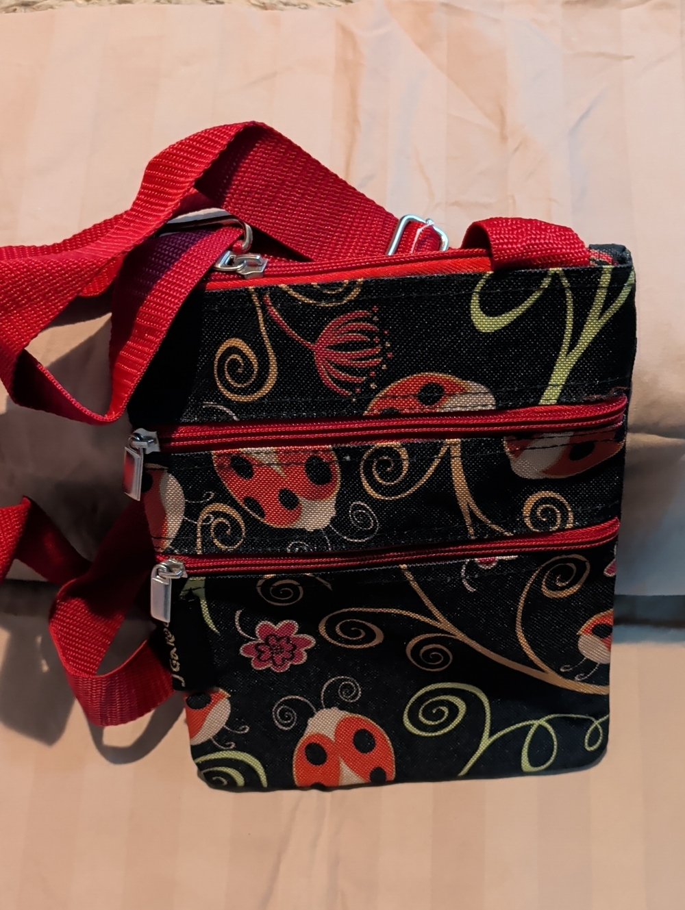 J Garden Crossbody Bag with Red Strap and Ladybug Print